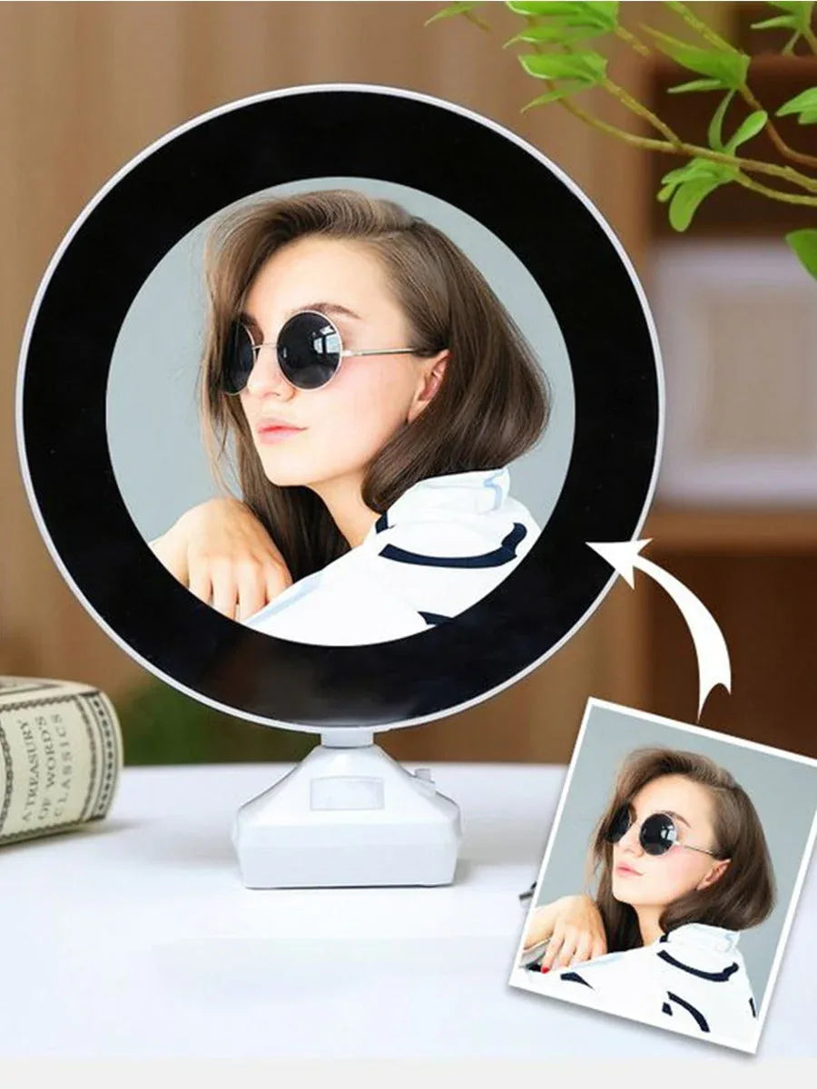 Modern circular photo frame displaying a portrait of a woman with sunglasses on a table